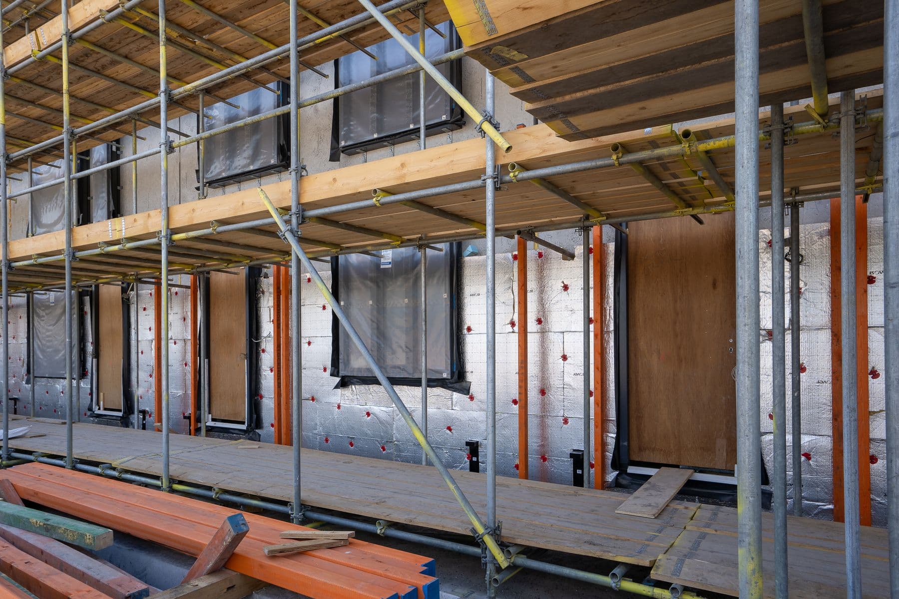 Residential building under active construction with scaffolding