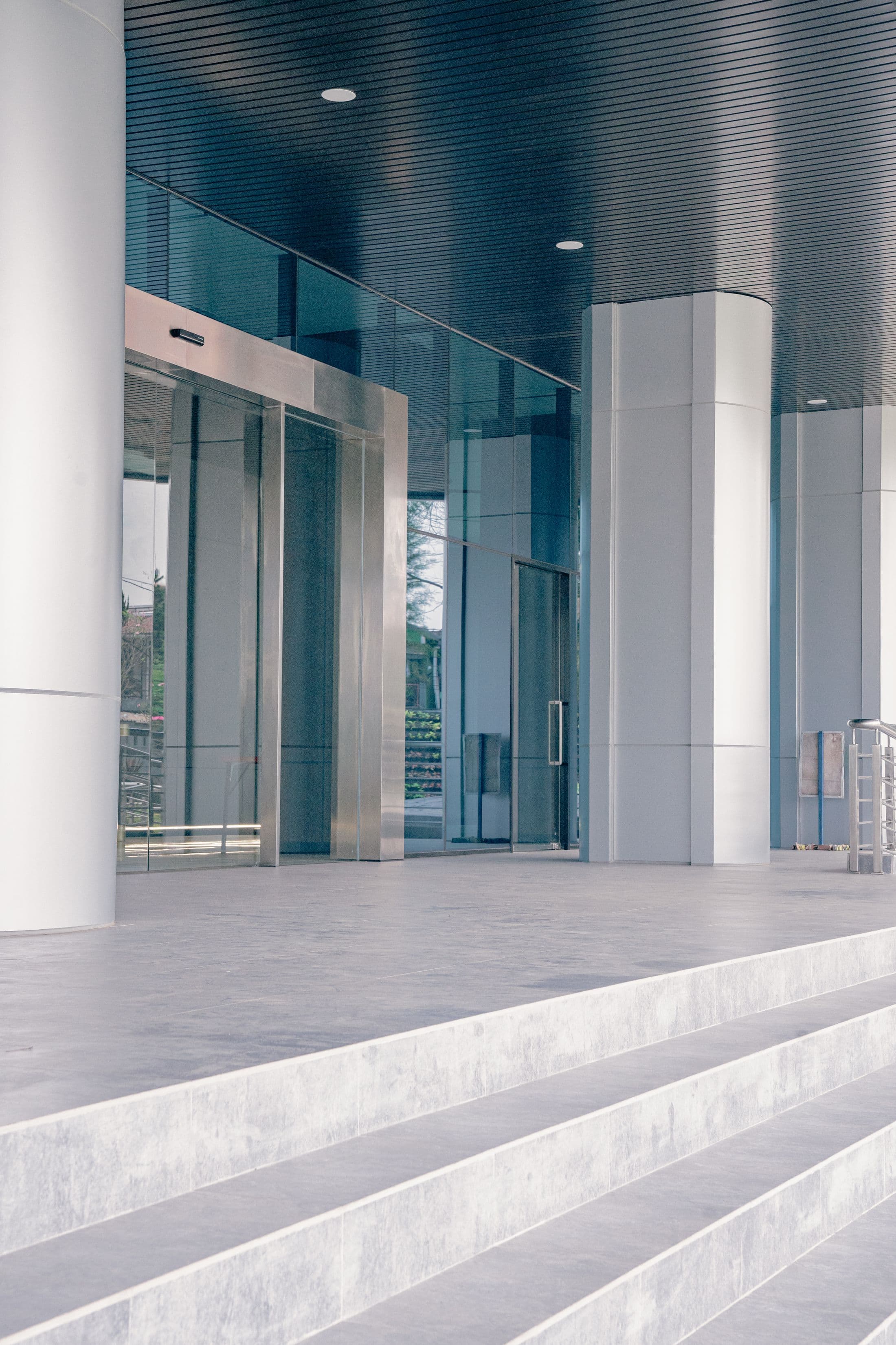 Ordered entrance to a contemporary glass and steel building