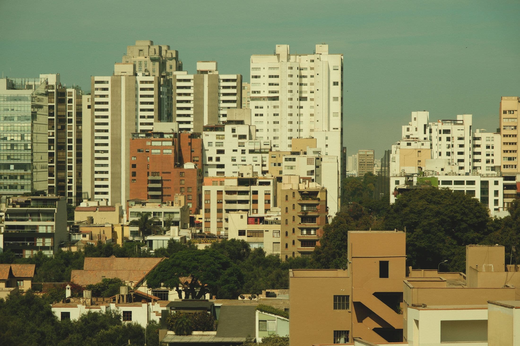 A dense urban property skyline with residential and commercial buildings